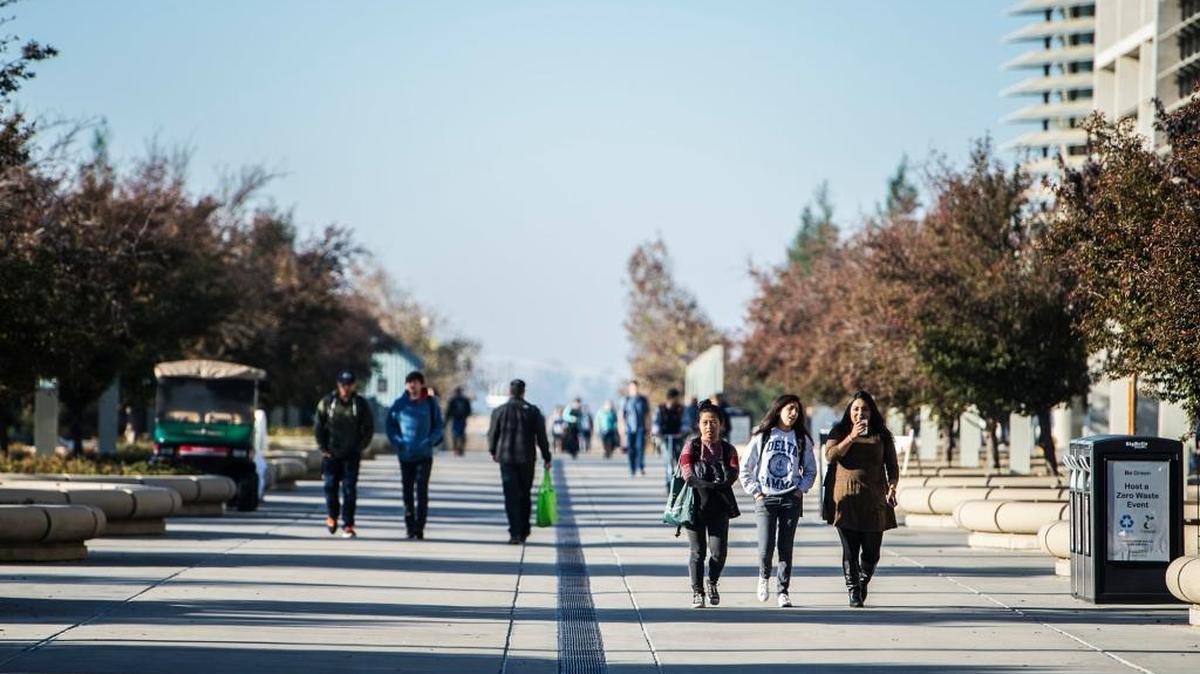 Students walk along Scholars Lane on the campus of the UC Merced in November. The school saw its number of applications rise once again.