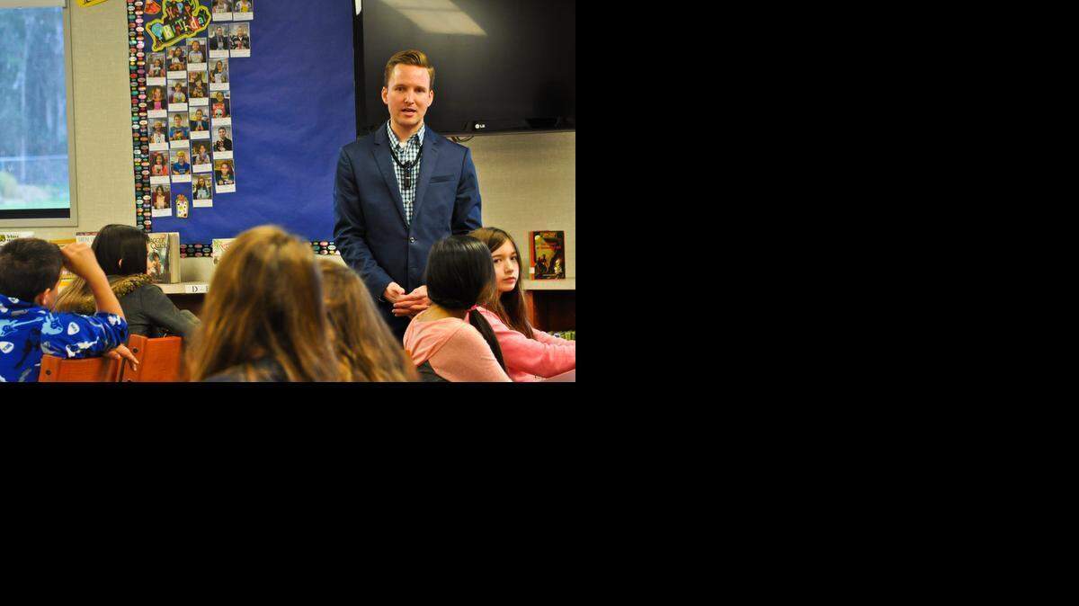 
CBS 47 morning news anchor Joey Horta, speaks to students about his education and career path during the celebrity readers event at McSwain Elementary on Friday.
