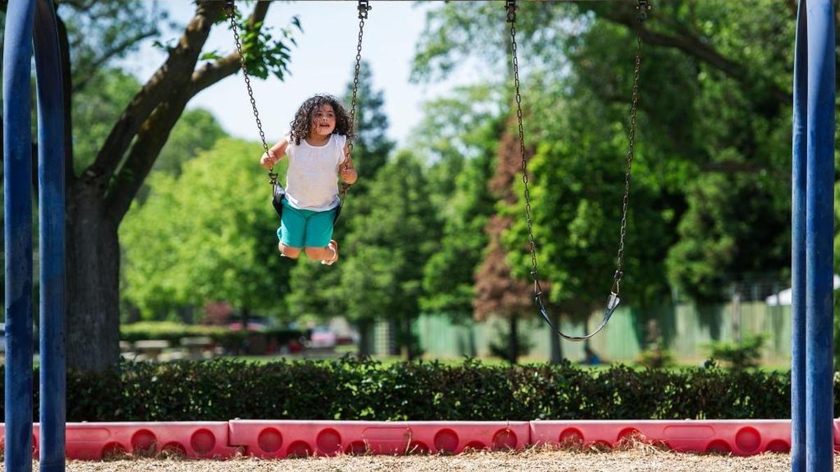 Gina Garcia, 4, of Merced swings at Applegate Park in Merced Wednesday, April 20, 2016. According to the American Lung Association’s State of the Air 2016, Merced County was the only county in the San Joaquin Valley that received a passing grade on particle concentration in the air.