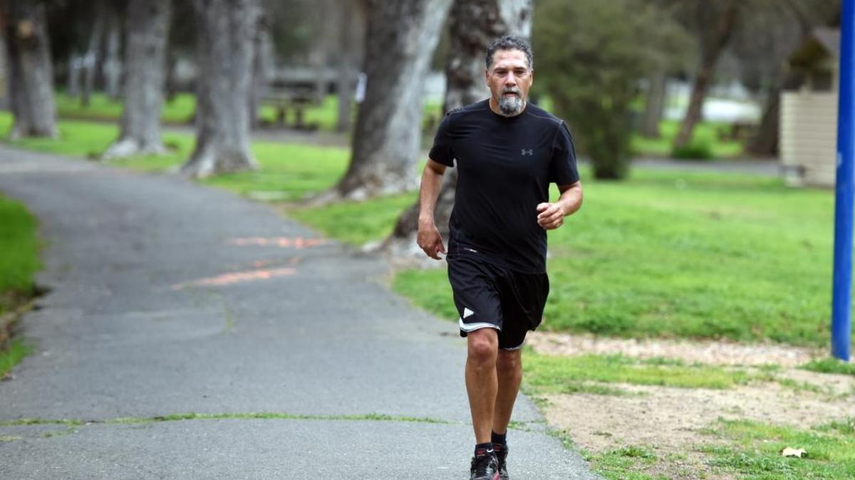 The windy and occasionally drizzly morning did not stop Bernie Ramirez, 46, of Merced from taking a jog on the bike path through Applegate Park on Wednesday. The forecast calls for more rain this week.