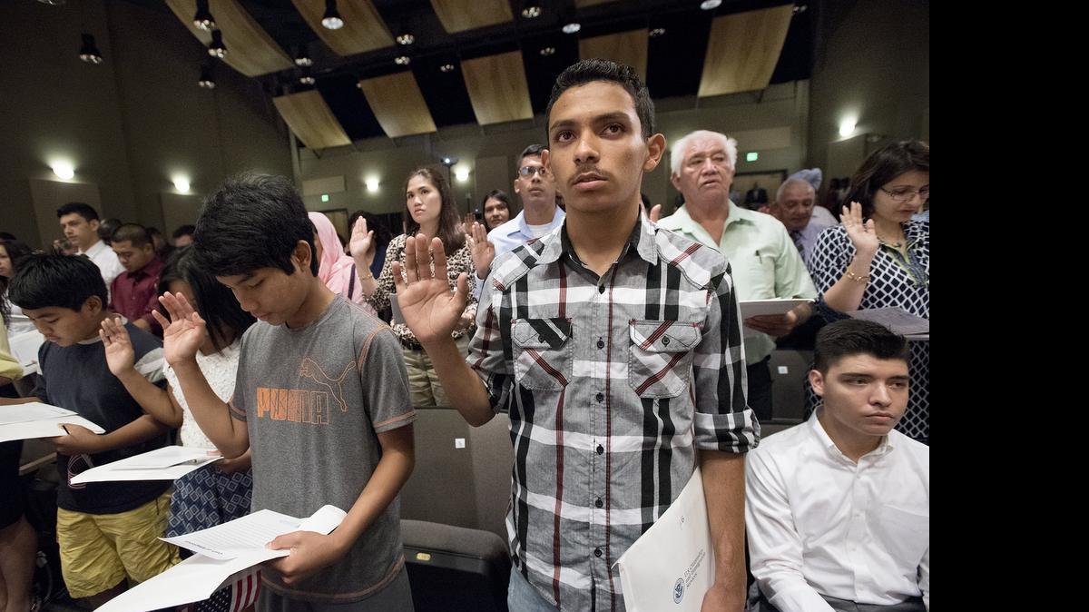 
Ignacio Manzo-Lopez, 16, of Merced takes the oath of allegiance during the U.S. Citizenship and Naturalization ceremony Wednesday at California State University, Stanislaus in Turlock.
