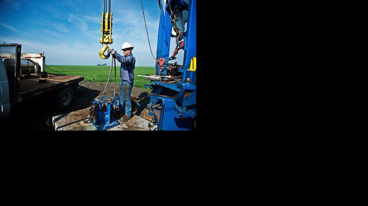 
Shannon Pump Co. employee Phil Vaughn works last month to extend an existing water well 90 feet on the San Felipe Ranch at 4455 Lone Tree Road in Merced. The ranch has had to fallow 300 acres of land and extend existing water wells in the drought
