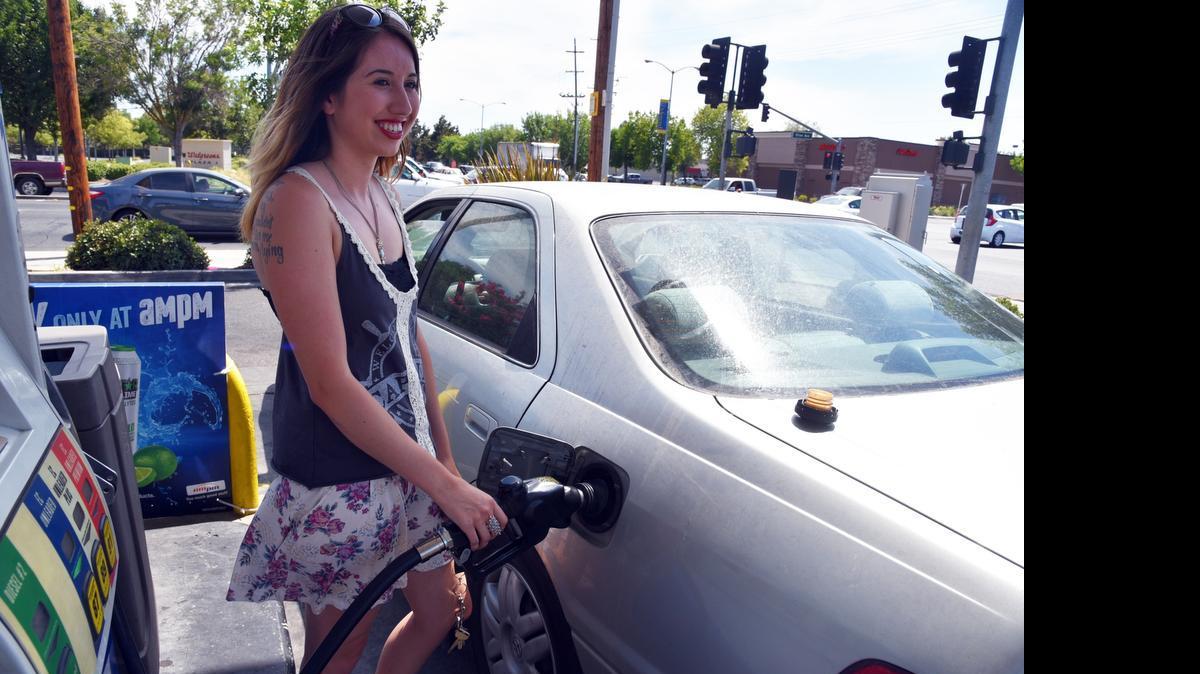 
Laura Griffin of Merced fill her tank on Monday at the Arco station at G Street and Olive Avenue in Merced.
