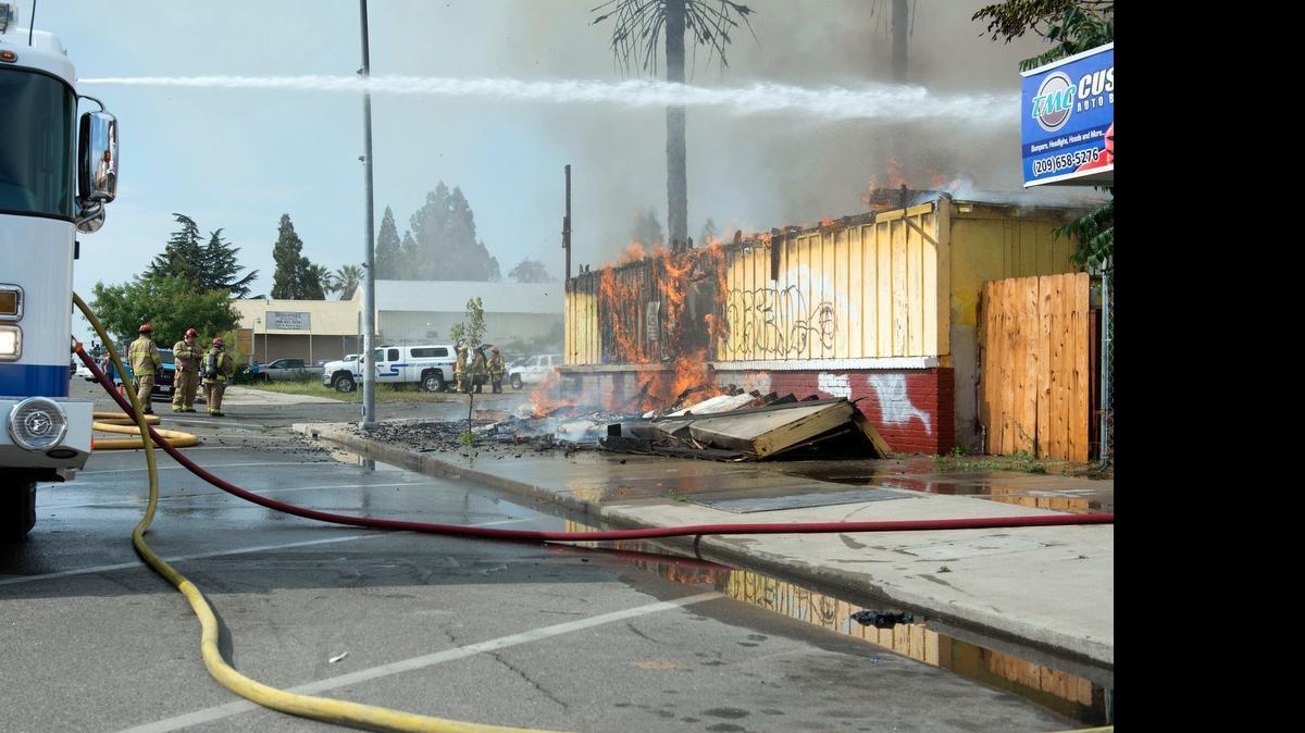 
California Department of Forestry and Fire Protection firefighters try to suppress a fire that started around 9:10 a.m. Friday at a vacant building at Gerard Avenue and Winton Way in Winton. Cal Fire said several homes and neighboring businesses in the area were threatened. No injuries were reported.
