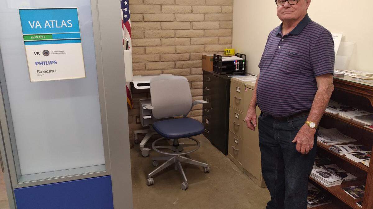 Los Banos Veteran Randy Williamson (standing) shows where a veteran checks in to the new ATLAS telehealth center in the Los Banos Veterans Hall.