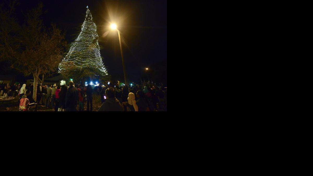 
Planada residents gather for the annual youth community Christmas tree lighting at Houlihan Park in Planada, Calif., on Thursday, Dec. 4, 2014. 
