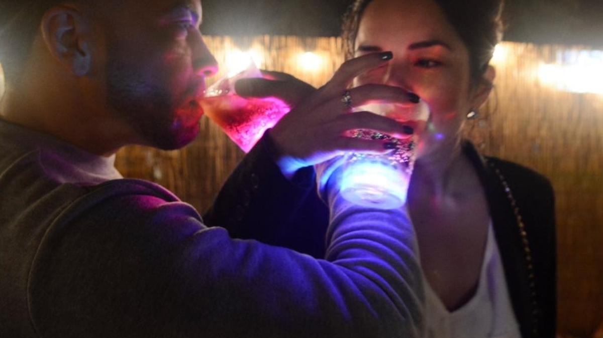 
Edwin Pauneto and Elizabeth Gomez of Gilroy enjoy a drink with their light-up souvenir cups during Our Lady of Fatima school’s Oktoberfest celebration last year in Los Banos.
