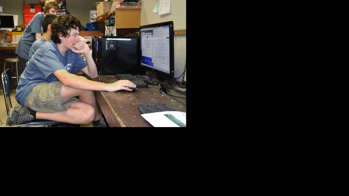 
Freshman Christopher Gemperle studies a “readme” file as part of the CyberPatriot competition at Turlock High School on Friday.
