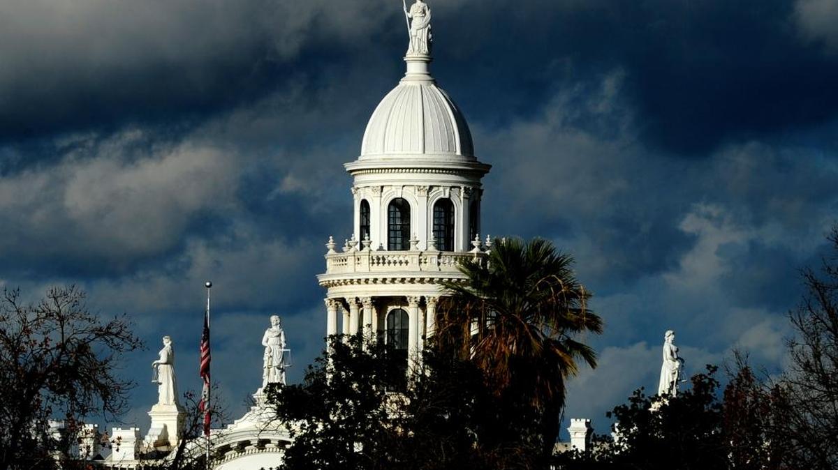 The tower atop the old Merced County Courthouse is viewed from the Shannon Parcade, backed by moving storm clouds, on Tuesday, Dec. 22, 2015, in Merced. The city ranked No. 47, up from No. 71 last year, on the Santa Monica-based Milken Institute’s 2015 list of Best Performing Cities. Milken uses a formula incorporating job growth, wage growth and improvements in high-tech industries, among other factors.