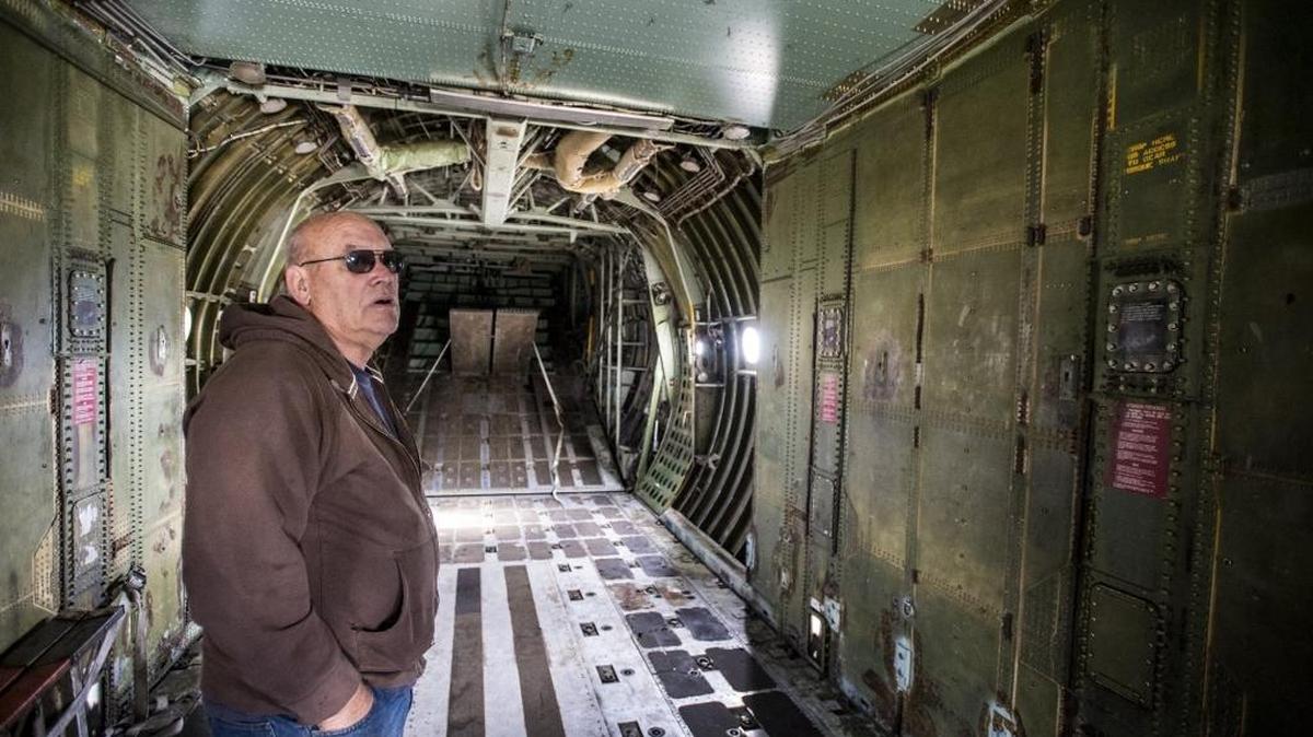 Norman Stubbs, president of TBM Inc., stands inside a Lockheed C-130 Hercules at the former Castle Air Force Base in Atwater on Wednesday, Nov. 25, 2015. The turboprop plane, designed for military transport, was donated by TBM Inc. in Visalia.