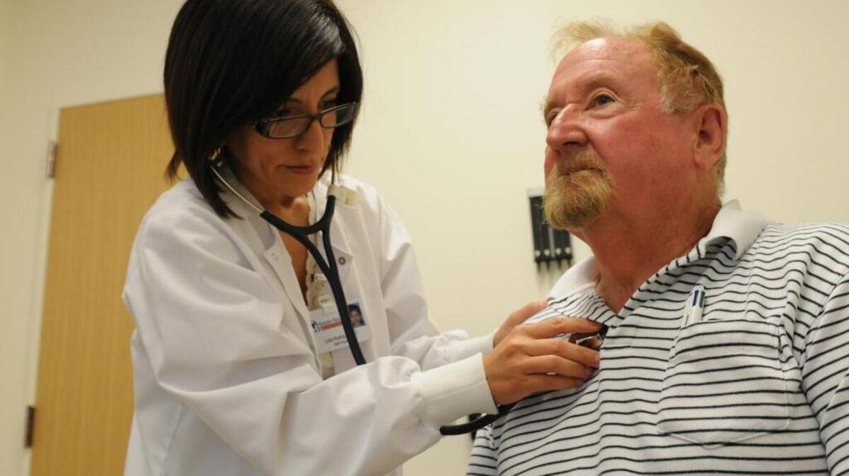 
Dr. Lidia Rodriguez gives a physical to Stephen Yerkes, 71, of Merced at the Senior Health and Wellness Center, part of Golden Valley Health Centers, in Merced in 2012.

