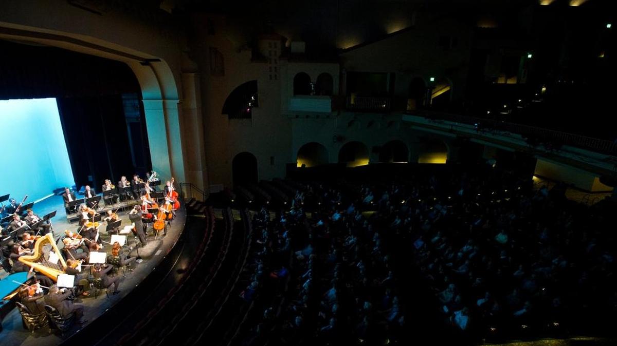 The Merced Symphony, conducted by Ming Luke, performs during the Merced Symphony’s annual Pops Concert at Merced Theatre in January.