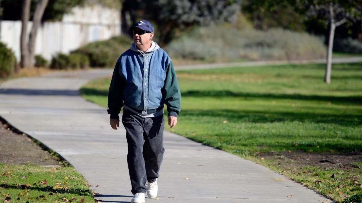 Ruben Cisneros, 63, of Merced walks along the Rascal Bike Path on a chilly Monday, like he does many days. The city might have to abandon plans to lengthen a portion of the path, because it has failed to get environmental clearance.
