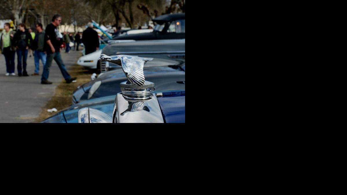 
The hood of a 1931 Model A Cabriolet shines as people gather during a past Turlock Swap Meet.
