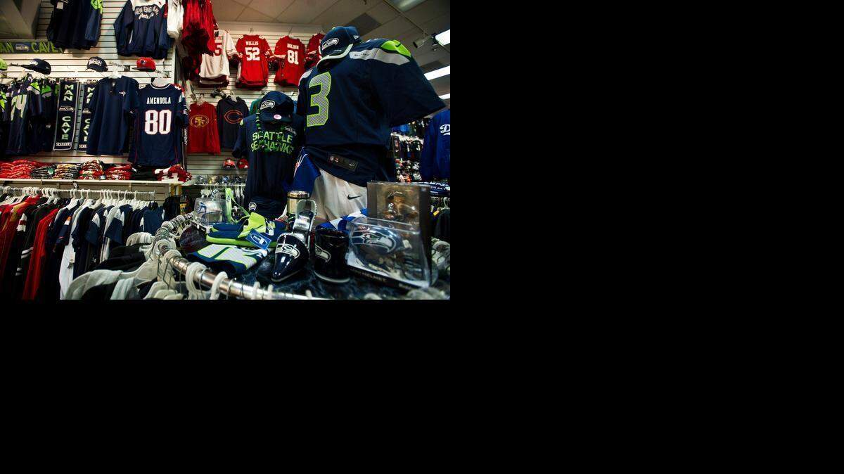 
Seattle Seahawks and New England Patriots apparel is up for sale at All American Sports Fan in the Merced Mall on Friday. The teams will be playing each other Sunday in Super Bowl XLIX.
