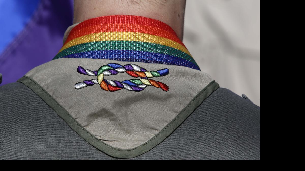 
A Boy Scout wears his kerchief embroidered with a rainbow knot during Salt Lake City’s annual gay pride parade in June 2014. The Boy Scouts of America’s top policymaking board voted Monday to end its blanket ban on gay adult leaders while allowing church-sponsored Scout units to maintain the exclusion if that accorded with their faith.
