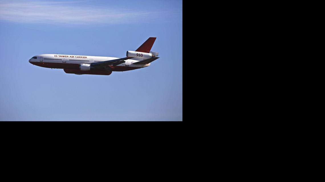 
A DC-10 air tanker makes a low pass at Castle Airport in Atwater, Calif., Saturday, Nov. 15, 2014. The Albuquerque, N.M.-based company 10 Tanker Air Carrier is retiring the DC-10 air tanker and flying it to Oscota, Mich., for dismantling. The aircraft, which was converted into an air tanker in 2004, began working for Cal Fire in 2006. The air tanker has dropped over 750 fire missions across the country and over 500 missions in the state of California.
