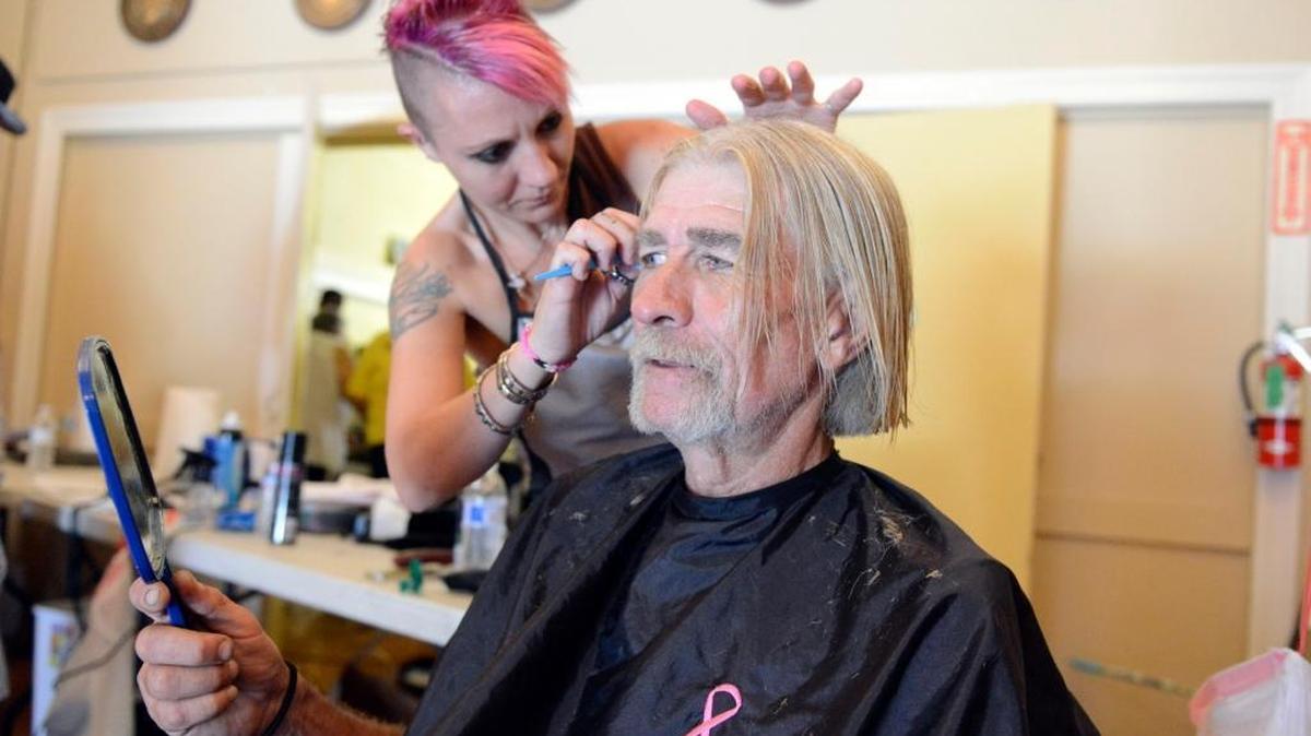 
Larry Smith, 58, of Merced coaches Mimi Backus, a hairstylist from This Is It 4 Hair & Nail in Atwater, on how he’d like his hair cut during the Homeless Connect event Friday, Sept. 25, 2015, at the American Legion Hall in Merced. Hundreds of people came for services from about 45 agencies, including those that provided haircuts, food and a photo ID.
