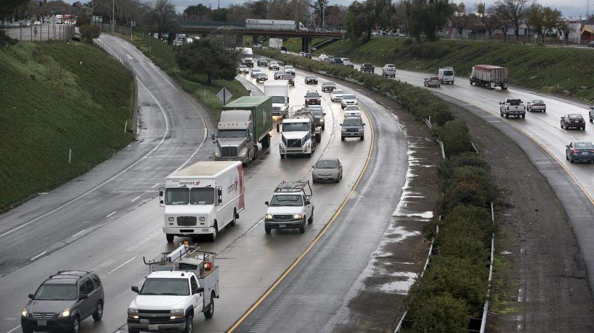 Traffic moves slowly along Highway 99 through Modesto, Calif., on Friday, Feb. 17, 2017.