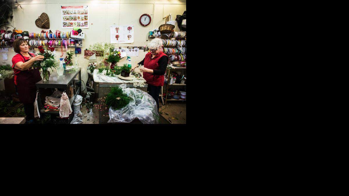 
Sherri Gipe, left, and owner Terry Vargas, both of Merced, create flower arrangements at A Blooming Affair Floral & Gifts in Merced on Friday.
