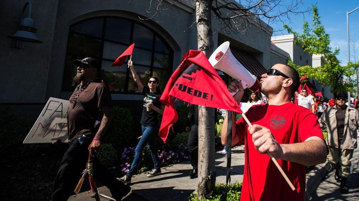 Joshio Flores, 29, of Merced, a member of the Merced College Movimiento Estudiantil Chicana/o de Aztlan, walks along 16th Street during the Cesar Chavez march in Merced last year. Chavez, a civil rights leader, established the United Farm Workers union. Participants marched from M and 16th streets to McNamara Park, at 11th and Canal streets, where they further honored the late civil rights leader.