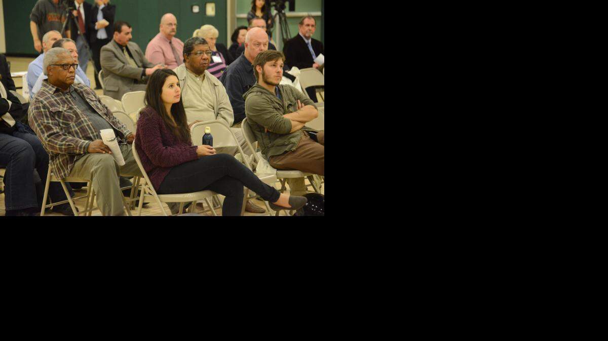 
A couple dozen audience members listen to a presentation last year during a town hall meeting at Rivera Middle School in Merced. 
