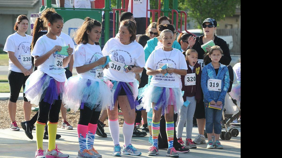 
Los Banos ranked 83rd in a ranking of “best towns to raise a family in California” by Niche.com. Runners are pelted with multicolored chalk dust at the beginning of the second annual 5K Color Fun Run at Persimmon Park in Los Banos. The event is to help raise money for the American Cancer Society.
