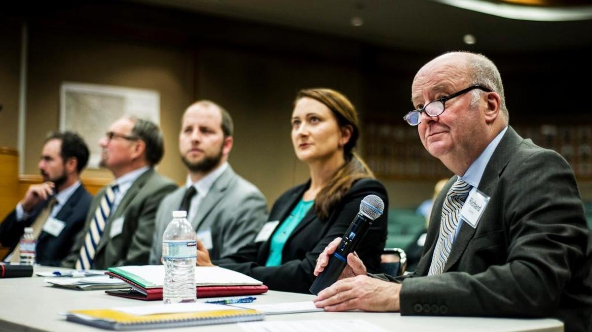Richard Davis, project manager for Hatch Mott MacDonald, right, speaks to Merced City Council members during a meeting at City Hall in October. Hatch Mott MacDonald was awarded a contract for the first phase of the high speed rail by the City Council.