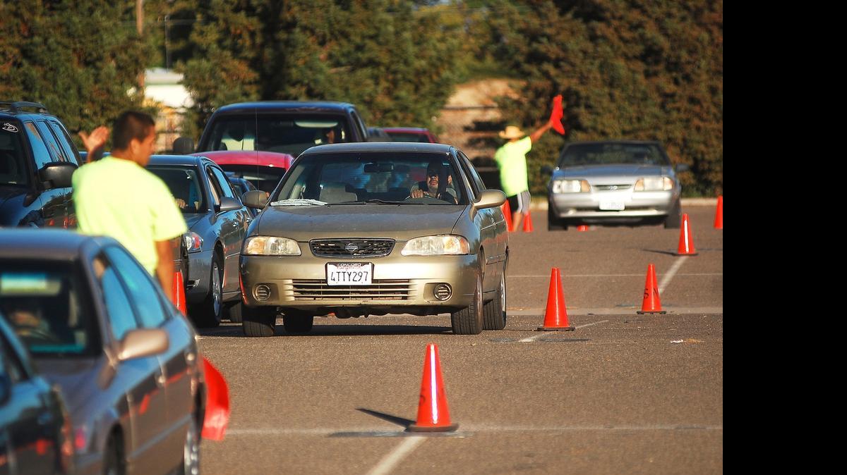 
San Joaquin Valley Air Pollution Control District and Valley CAN officials line up hundreds of vehicles at the Stanislaus County Fairground in Turlock for a previous Tune in and Tune up smog program. A similar event is planned at 9 a.m. Saturday at the Merced County Fairground, 900 Martin Luther King Jr. Way.
