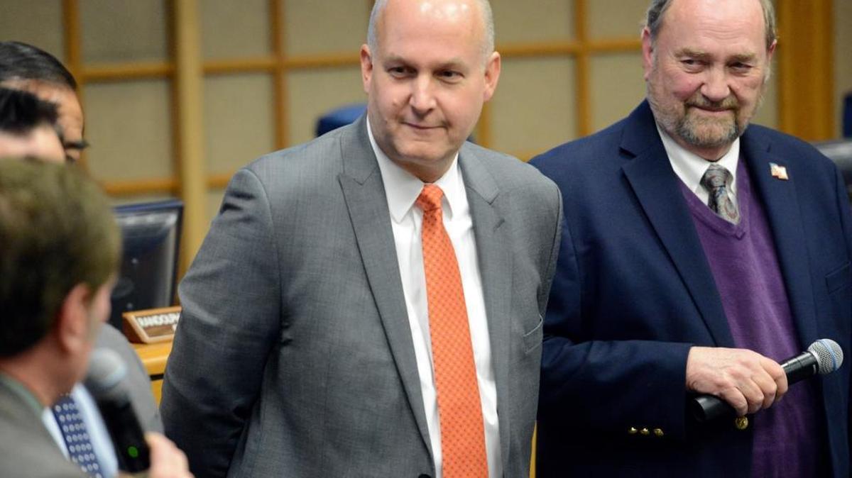 Steve Carrigan, center, listens to the Merced City Council and Mayor Stan Thurston, right, speak about him after they approved a contract hiring him as the next Merced city manager on Monday, Dec. 7, 2015. He is set to begin Jan. 25.