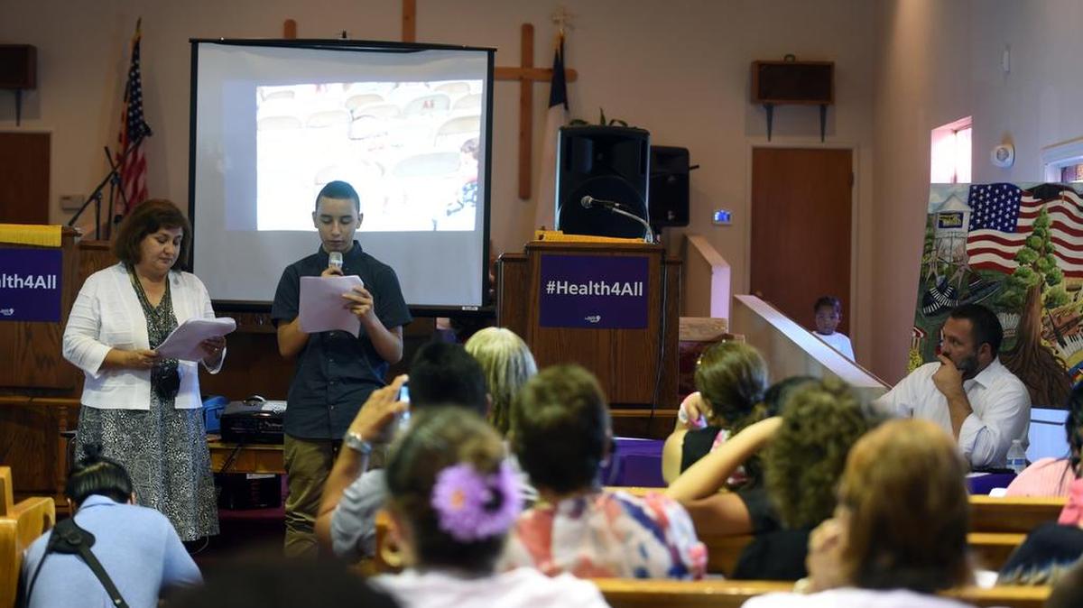 
Alejandro Delgado, 15, shares the story of a family member who struggled to pay medical bills after an accident during Thursday’s Health for All forum at Mount Pisgah church. The family member, Delgado said, was not eligible for health coverage because of immigration status. 
