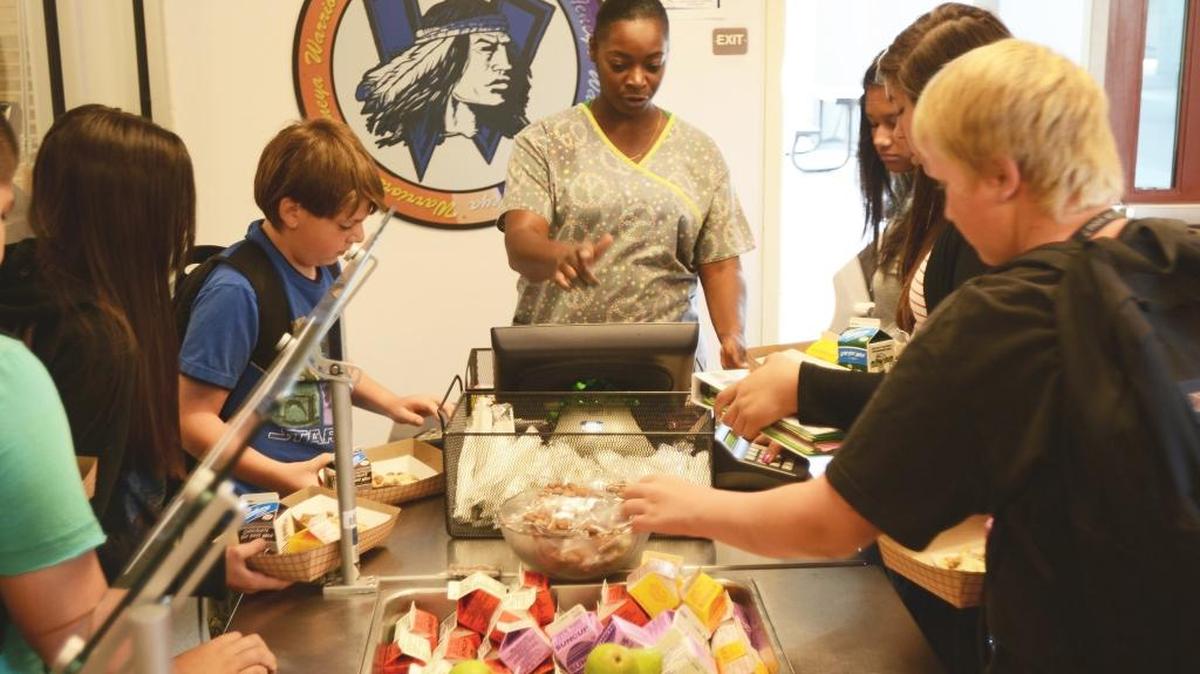 School Nutrition Services employee Serena Williams of Merced checks students out during breakfast at Tenaya Middle School in Merced in 2013. Merced County’s government sector added 1,100 jobs from January to February, a reflection of classified school employees returning from the winter break, said Steven Gutierrez, a labor analyst for the EDD’s Fresno office.