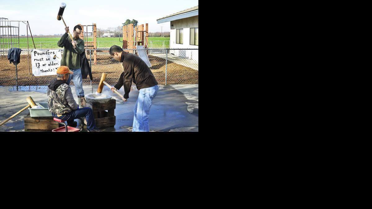 
Participants in the recent mochi pounding event at United Methodist Church of Livingston are shown pounding the rice dough with hammers. 
