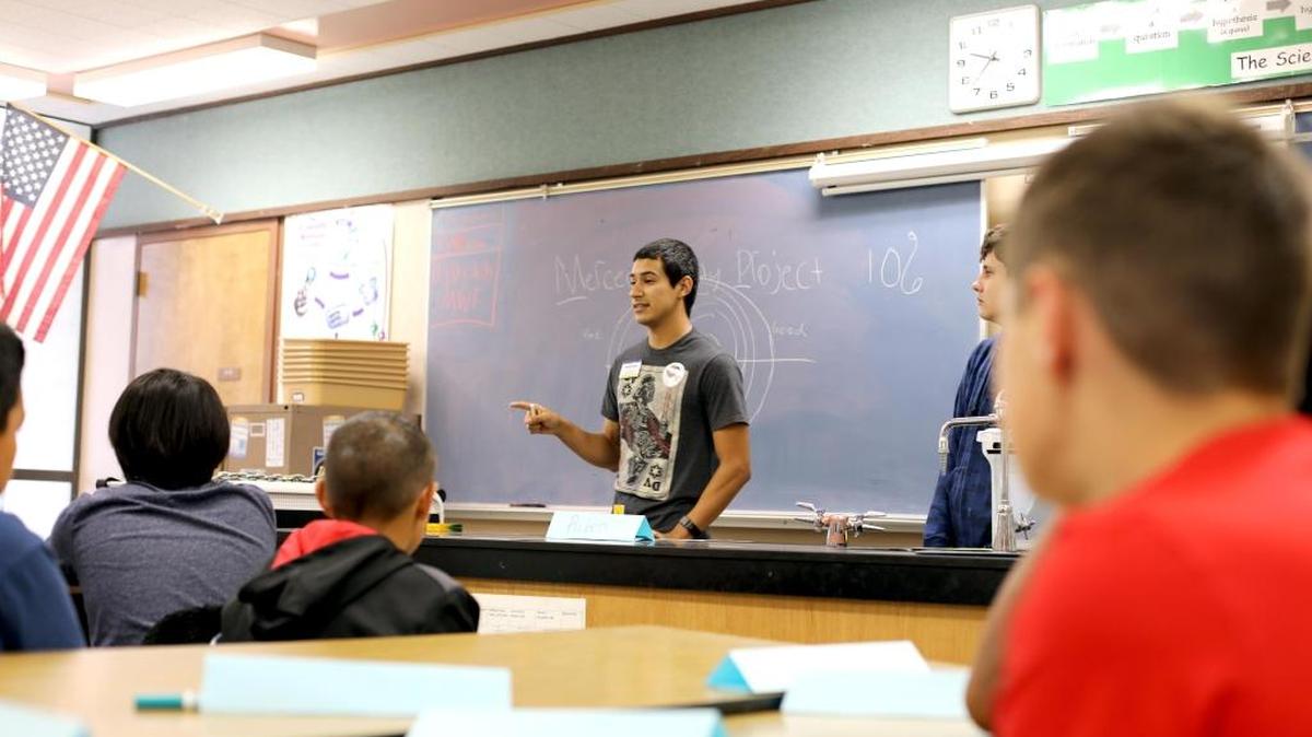 UC Merced student Ruben Reyes speaks to Cruickshank Middle School students in October about the importance of graduating from high school.