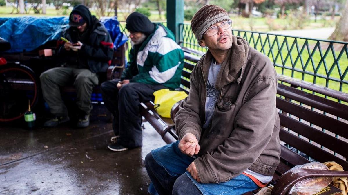Charles Moreskine, 42, speaks about various places the Merced homeless take shelter during inclement weather as he sits under the gazebo on a rainy day in Applegate Park in Merced, Calif., on Saturday, Jan. 7, 2017. “We always try to help someone; we just don’t let someone suffer,” said Moreskine. “It’s kind of like a community a little bit.”