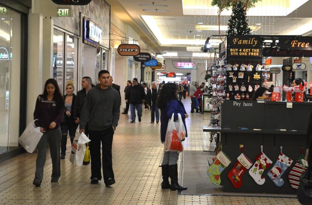 People get in some last-minute shopping Saturday at the Merced Mall.