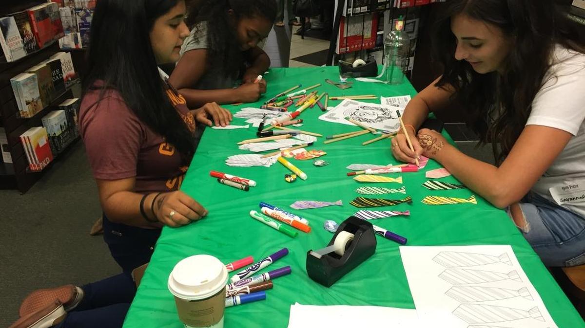 “Harry Potter” fans decorate their cafe drinks with Hogwarts uniforms at the Merced, Calif., Barnes & Noble midnight premiere of “Harry Potter and the Cursed Child” on Saturday, July 30, 2016.