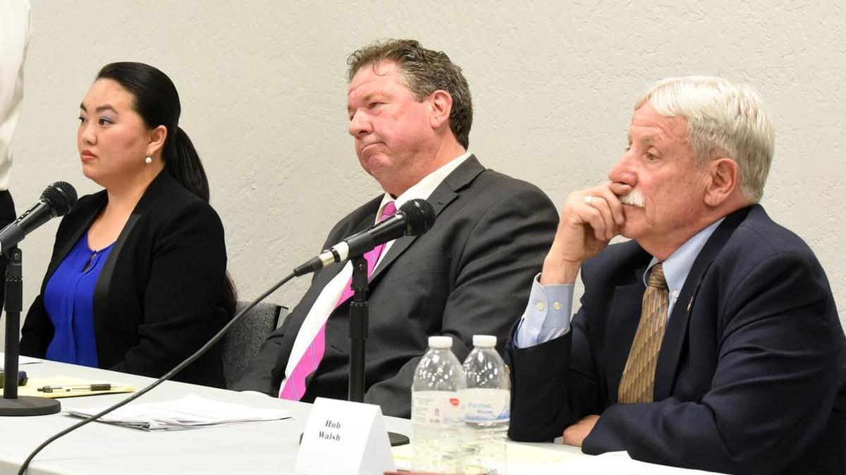 Merced County District 2 supervisor candidates Lee Lor, Casey Steed and Hub Walsh listen to a question from the audience at the Merced County Association of Realtors forum on Tuesday, April 12. Results from the June 7 primary show Lor and Walsh will head to a runoff vote in November.