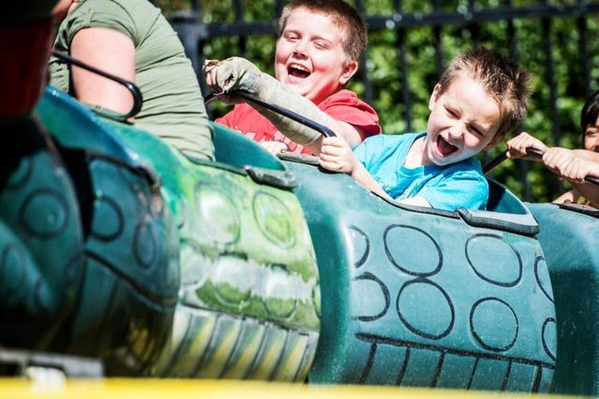 Jacob Bissell, 9, center, and James Craig, 6, both of Merced, enjoy the Go-Gator ride at Kiddieland on April<133>4 after the Kiwanis Club Easter Egg Hunt.<252><137>following the 25th annual Kiwanis Club of Greater Merced Easter Egg Hunt at Applegate Park in Merced, Calif., Saturday, April 4, 2015. Merced Golden Valley and Livingston Key Club members filled thousands of plastic eggs with candy and receipts for prizes.<252><137>