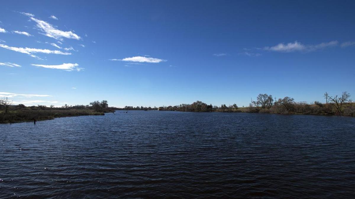 The Merced River is seen from Hornitos Road in Snelling on Jan. 5. The wealth of rain falling on Merced County this year led the Merced Irrigation District board on Friday to approve a budget that will allow district growers to buy as much water as they want.