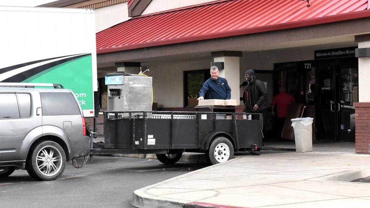 Workers load equipment from Merced’s Hometown Buffet restaurant on Olive Avenue into moving trucks and trailers on Monday. A sign posted on the doors of Hometown Buffet said the restaurant was closed for “asset inventory” and asked employees to return Tuesday for further instruction. The restaurant’s parent company, Buffets LLC, filed bankruptcy Monday, March 7, 2016. It was not immediately clear whether the Merced location will permanently close.