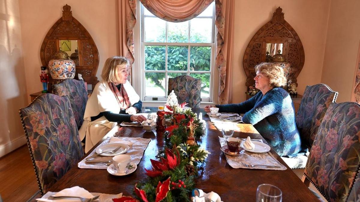 Sisters Melinda and Jana Stewart, who bought the Bear Creek Inn in 2014, enjoy a cup of tea and scone in the dining room. The Stewarts hope the inn will remain a fixture in the community and grow as a destination wedding venue and go-to spot for local events.