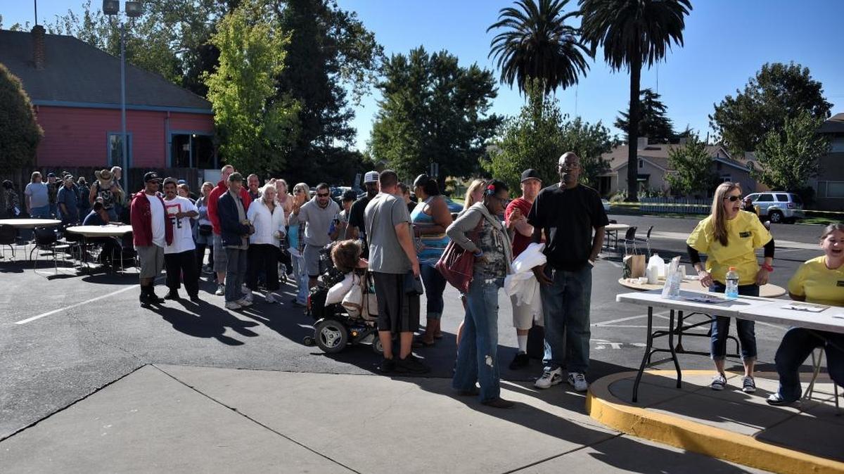 People line up outside Central Presbyterian Church’s Hoffmeister Center before Merced’s Homeless Connect event on Friday, Sept. 23, 2016.