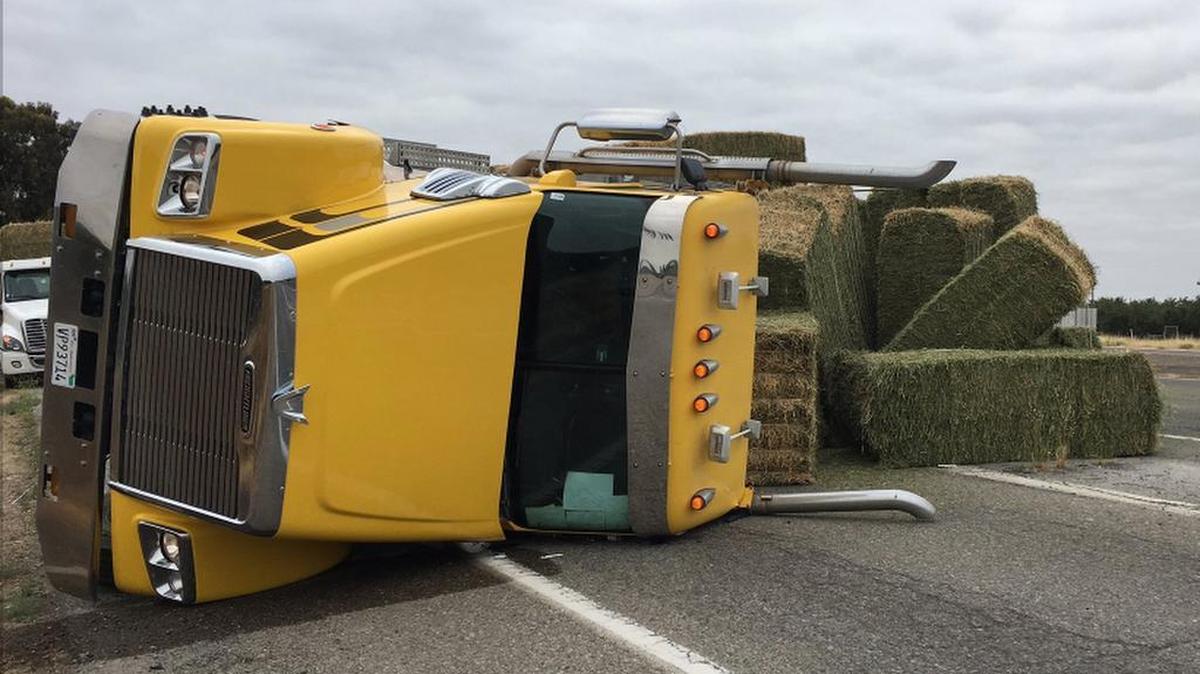 A big rig carrying hay bales overturned Friday morning, forcing a closure from the interchange from southbound Highway 99 to westbound Highway 152, the California Department of Transportation reported. It is the third big rig to overturn on Highway 99 between Merced and Madera this week.