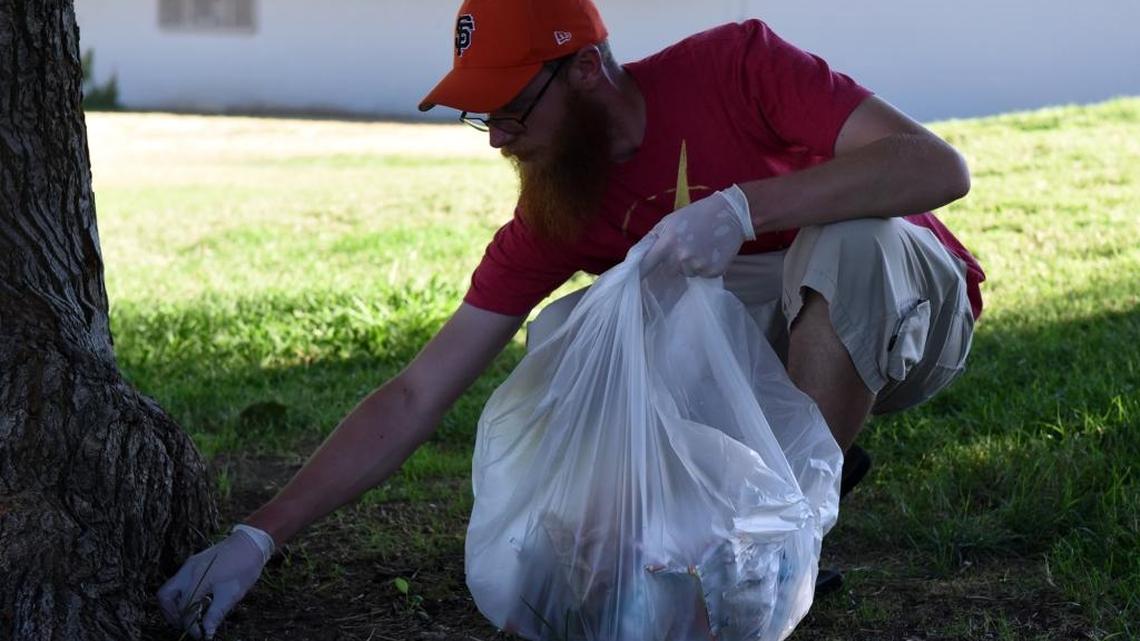 Robert Kostecky, 26, of Merced picks up trash at Applegate Park in Merced on Wednesday, July 20, 2016. “I typically vote Republican,” he says. “I definitely got some issues with Trump.”
