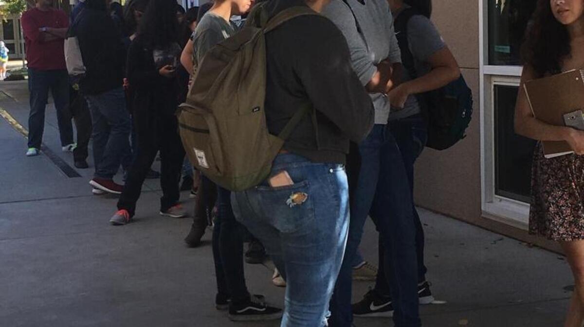 A line of people waits to vote Tuesday at the UC Merced polling station.
