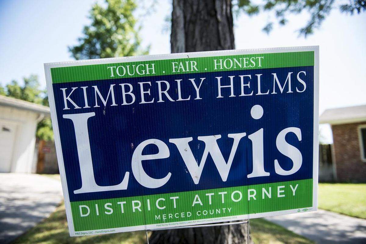 A campaign sign for District Attorney candidate, Kimberly Helms Lewis, is seen outside of a home on San Rafael Court in Merced, Calif., on Thursday, May 31, 2018.