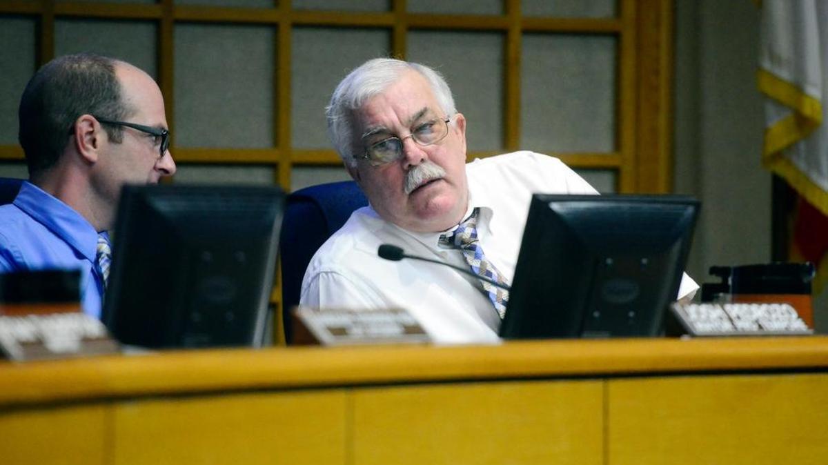 Councilman Tony Dossetti speaks to Councilman Josh Pedrozo during the Merced City Council meeting on Sept. 8. Dossetti told the Sun-Star on Thursday he will not seek re-election.
