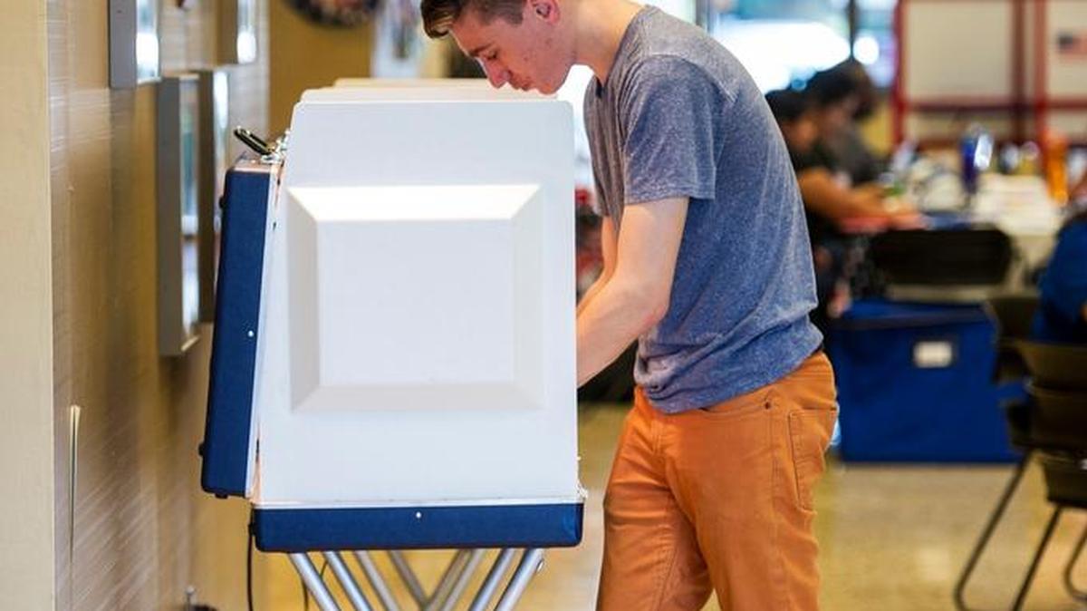 Graham Baird, 22, fills out his ballot at the Merced County administration building, 2222 M St. in Merced, Calif., on Tuesday, June 7, 2016.