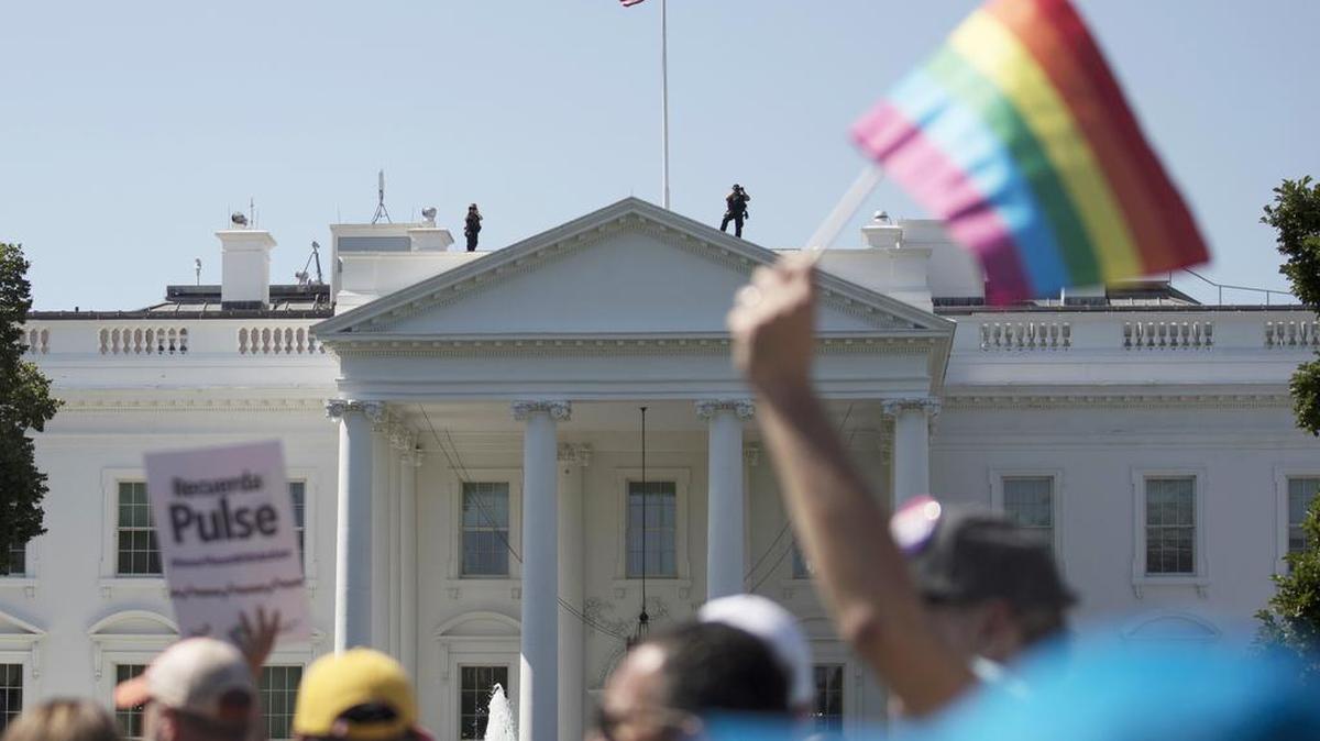 Equality March for Unity and Pride participants demonstrate past the White House in Washington in June. A federal court in Washington is barring President Donald Trump from changing the government’s policy on military service by transgender people.